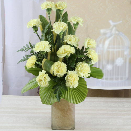 Shining Yellow Carnations in a Glass Vase