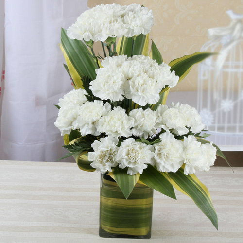 Twenty One White Carnations in a Glass Vase