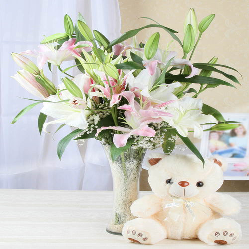 Attractive Lilies Arrangement with Teddy Bear