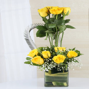 Arrangement of Ten Yellow Roses in a Glass Vase