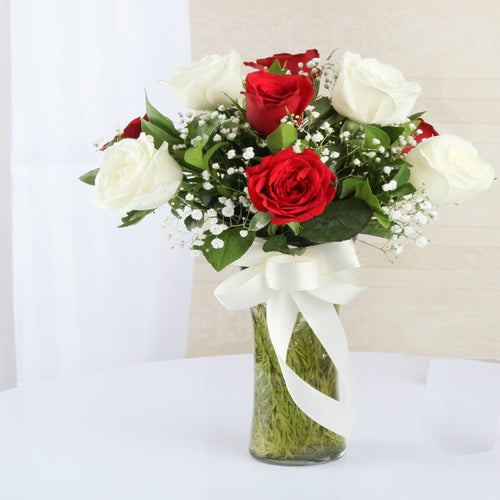 Arrangement of Red and White Roses in a Vase