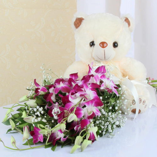 Twelve inch Teddy Bear with Orchids Bouquet