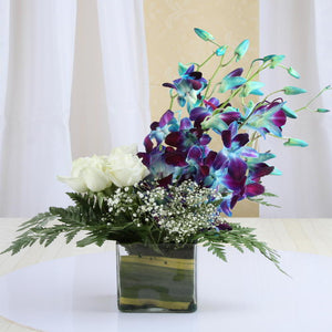 Exotic Arrangement of Orchids with Roses
