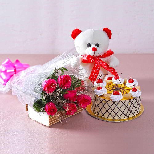 Bouquet of 6 Pink Roses with 1 kg Butterscotch Cake and Cuddly Bear