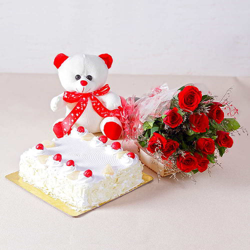 Ten Romantic Red Roses with One Kg Pineapple cake and Teddy Bear