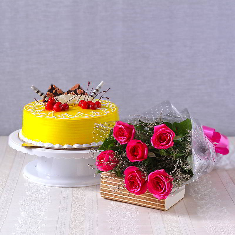 Half kg Pineapple Cake with Six Pink Roses Bouquet