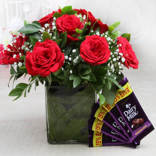 Arrangement of Red Roses in a Vase with Cadbury Chocolate Bars