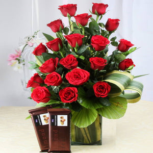 Arrangement of Red Roses in a vase with Temptations Chocolates