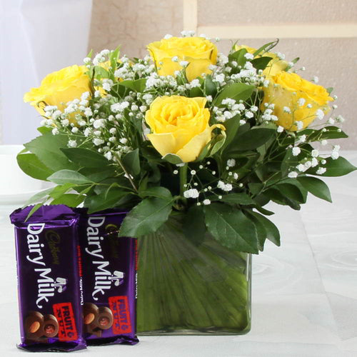Pretty Yellow Roses in Vase with Dairymilk Fruit n Nut Chocolates