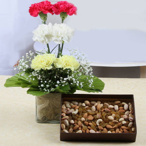 Gorgeous Six Carnations Glass Vase with Assorted Dry Fruits