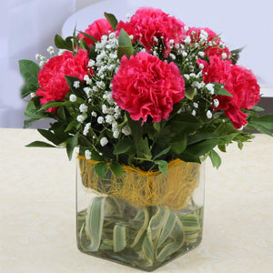 Six Adorable Pink Carnations Arranged in Glass Vase