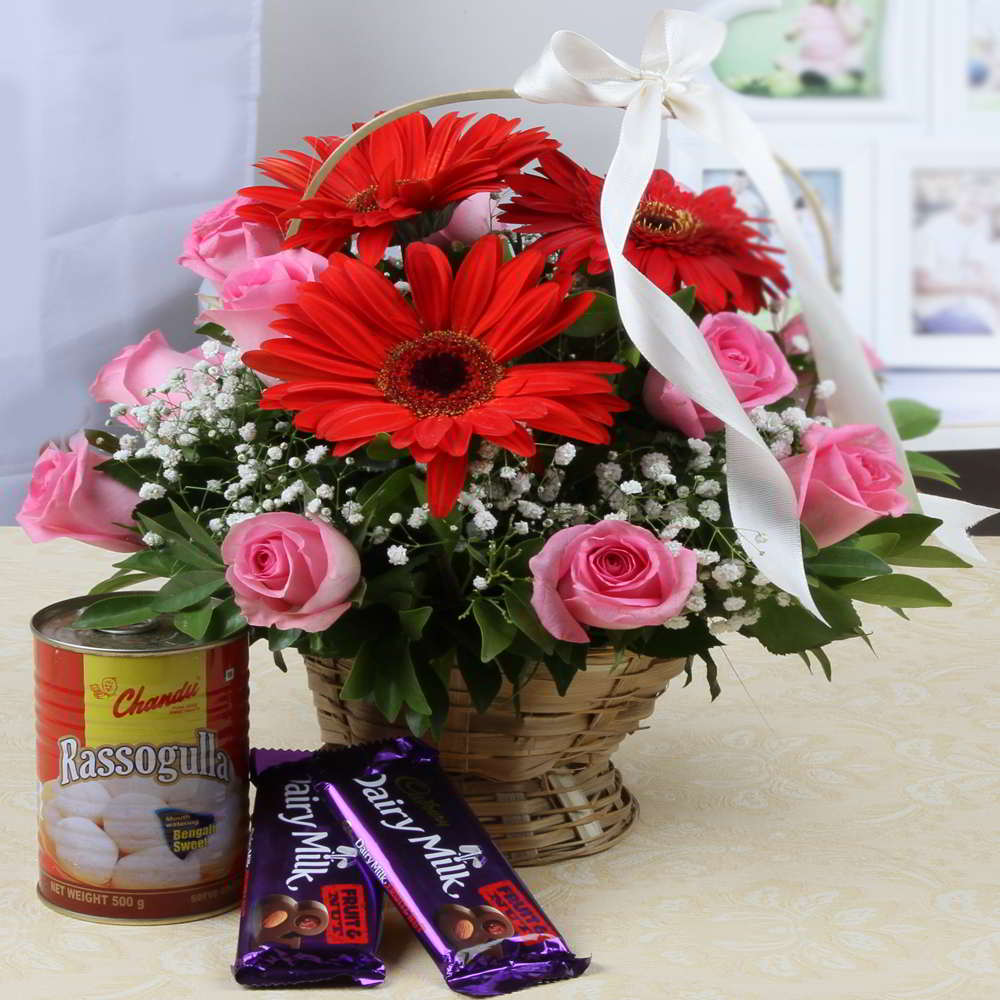 Flowers Basket with Cadbury Fruit N Nut Chocolate and Rasgulla Sweets